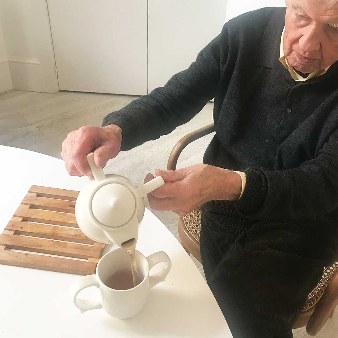 two handled tea pot